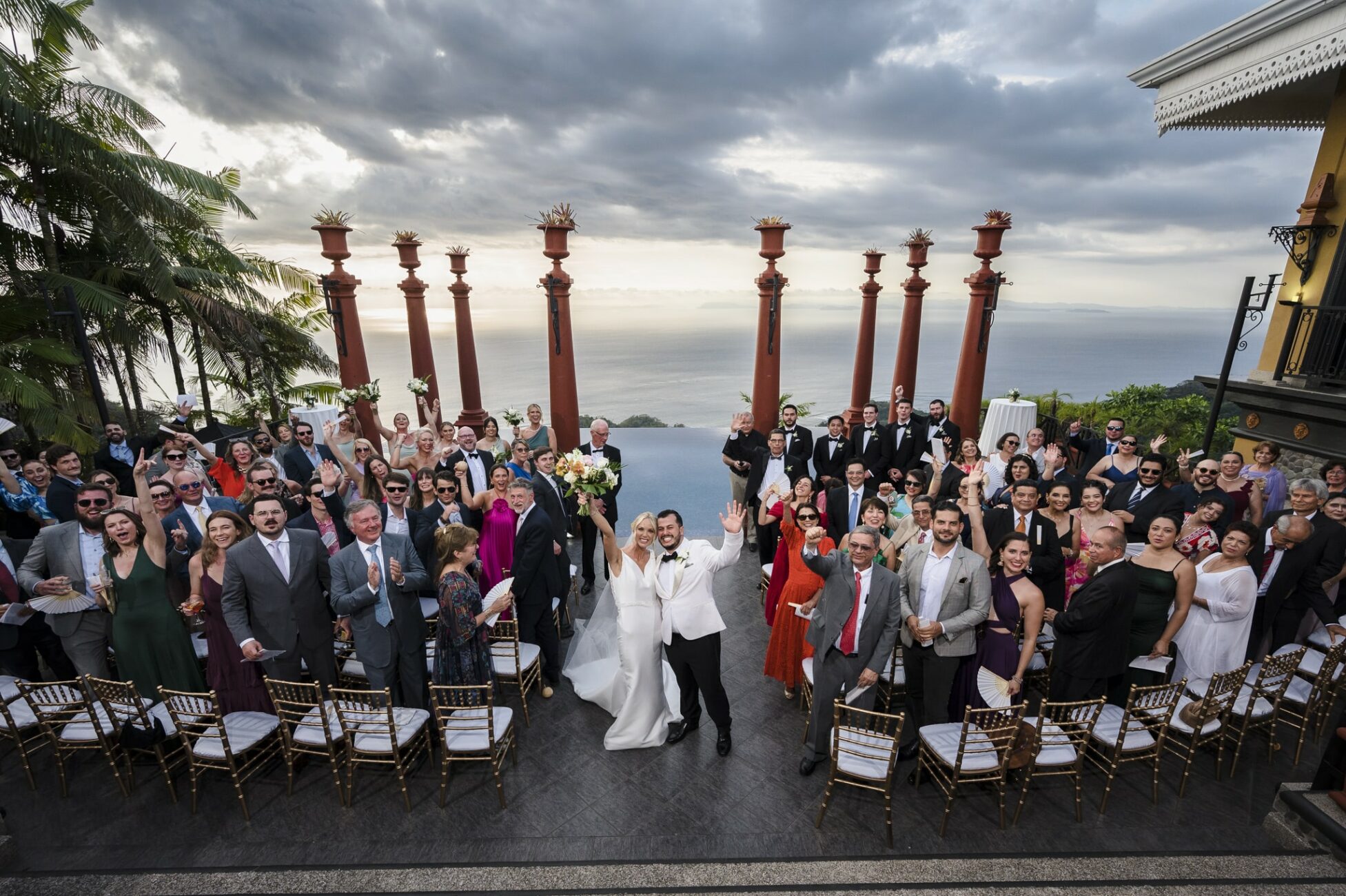 Bride and groom celebrating they just got married at the stunning Zephyr Palace at Villa Caletas Hotel