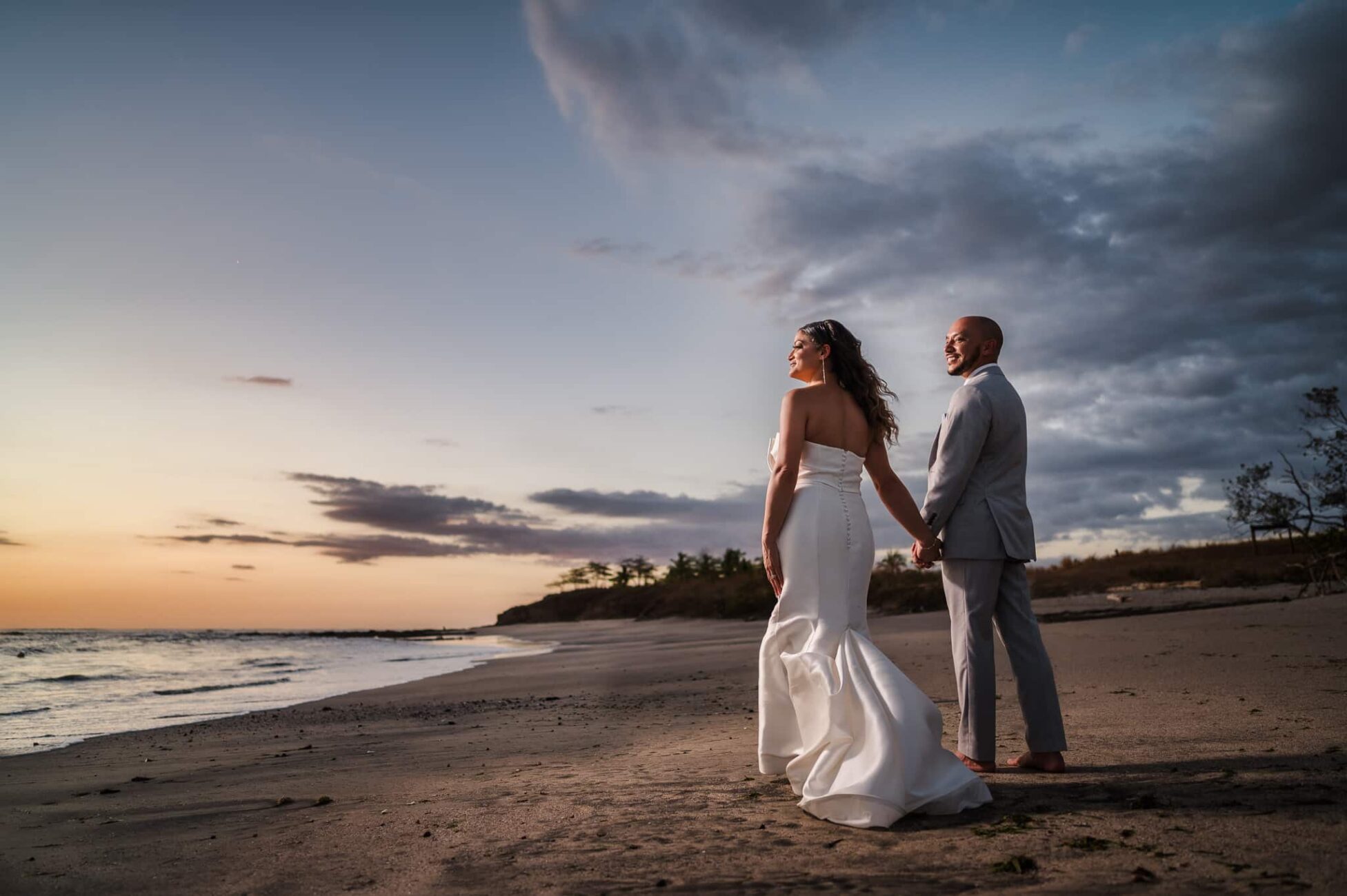 Portrait of a couple after their JW Marriott Guanacaste Wedding during sunset at Mansita Beach.